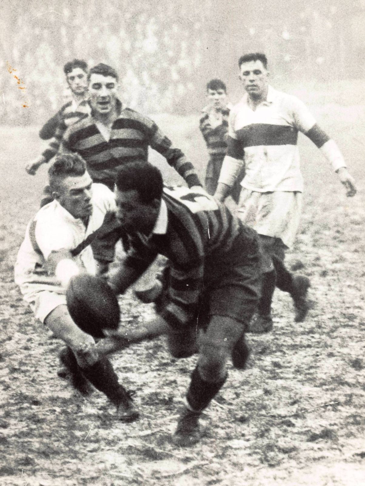 Alex Givvons scoops up a loose ball pursued by Izzy Davies with Edgar Brooks and Arthur Holsgrove looking on - Feb 2nd 1935.