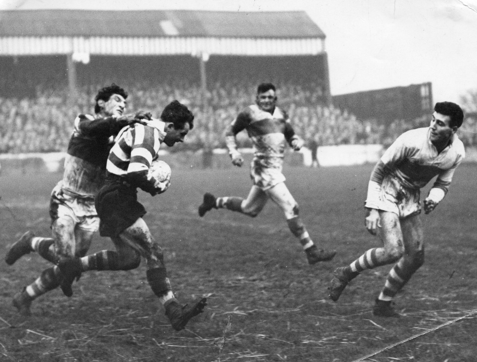 Dennis Ayres is collared by Vince Karalius with Frank Carlton on hand if required - Dec 8th 1956.