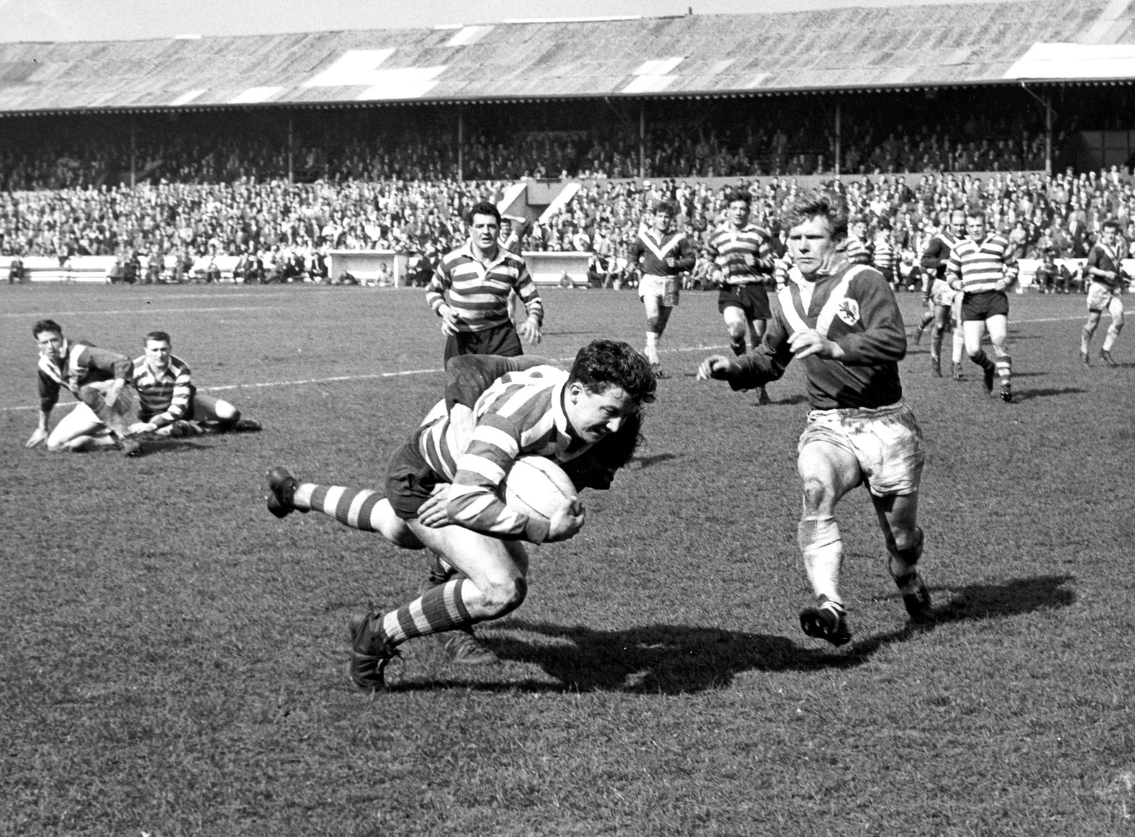 Mike Bird falls to a Swinton tackle - April 28th 1962.