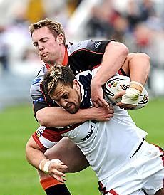 Oldham's Jason Boults gets to grips with Danny Sculthorpe, of Wakefield - June 1st 2008.