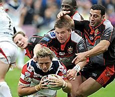 Oldham duo Adam Robinson and Said Tamghart cant prevent Oliver Wilkes from scoring a try for Wakefield - June 1st 2008.