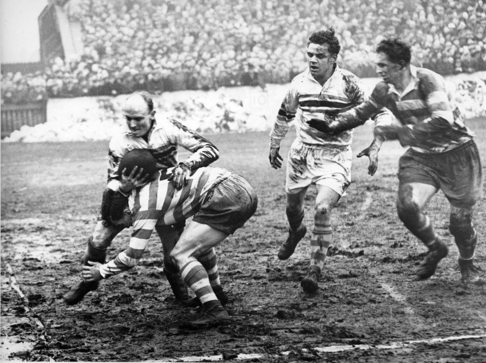 Brian Bevan is bundled into touch by Terry O’Grady with Ted White and Sid Little in attendance - March 6th 1954.
