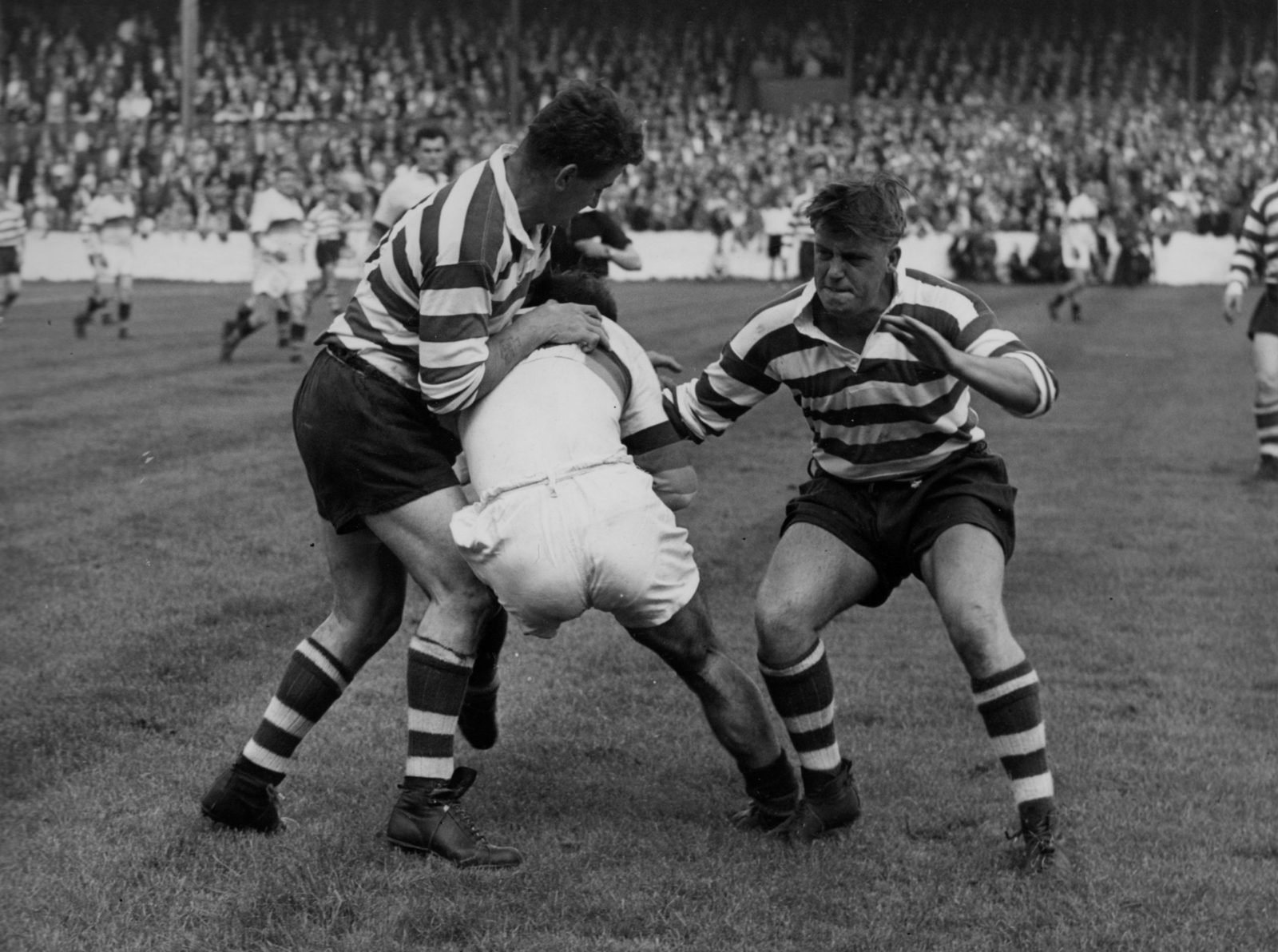 Derek Turner and Des McKeown get to grips with a Whitehaven player - Aug 30th 1958.