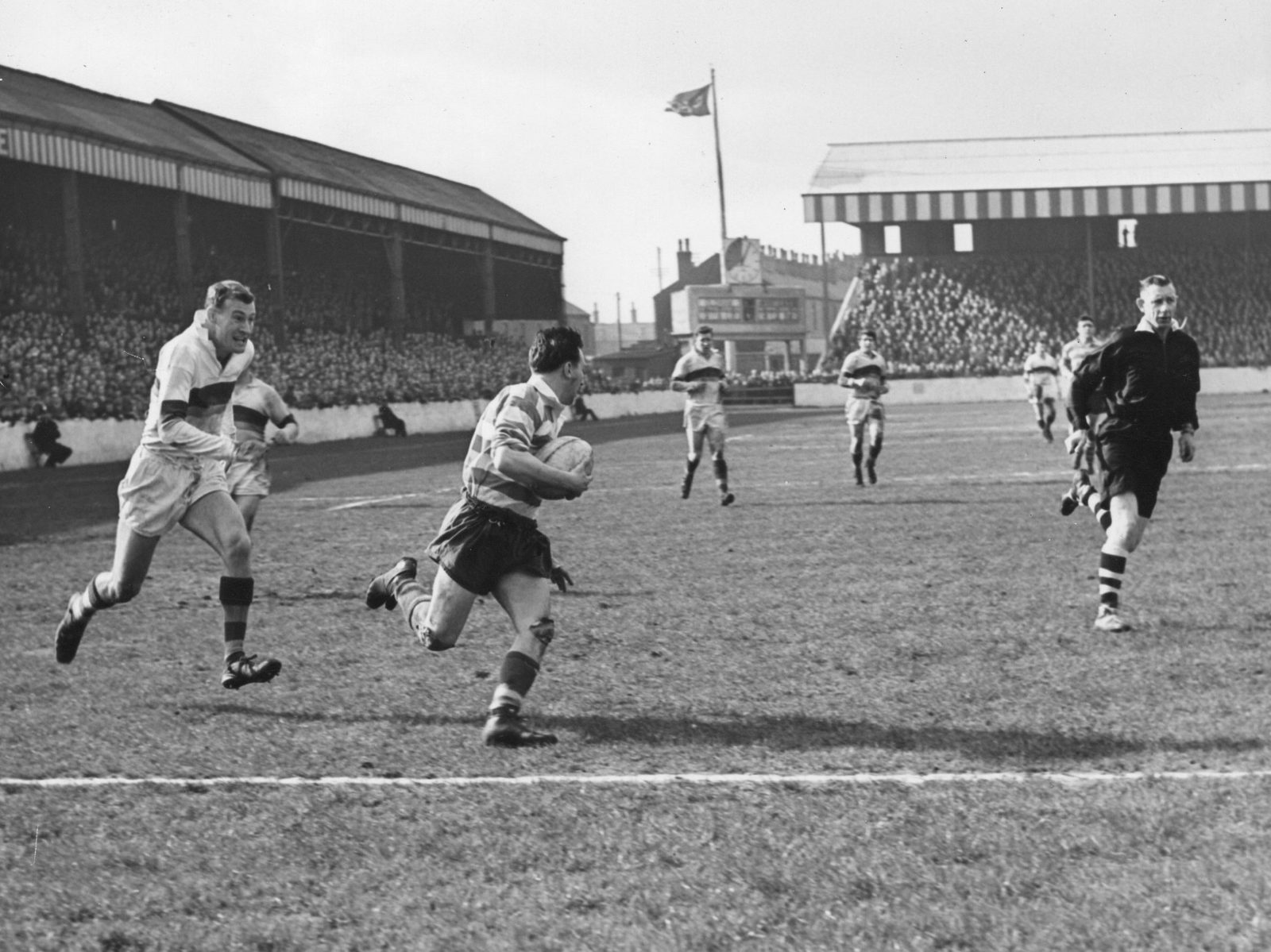 Frank Pitchford leaves several Whitehaven defenders in his wake as he goes over for one of his two tries - April 18th 1959.