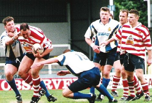 Mike Prescottis caught by two Whitehaven defenders while Laurent Minut looks on- May 30th 1999.