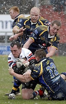 Tommy Goulden drives the ball in, on a snowy Boundary Park - April 6th 2008.