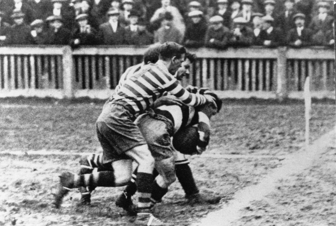 Three Oldham defenders put a Widnes man in touch - Feb 21st 1925.