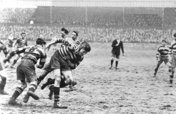 Bob Sloman is brought down after releasing the ball v Widnes - Feb 21st 1925.