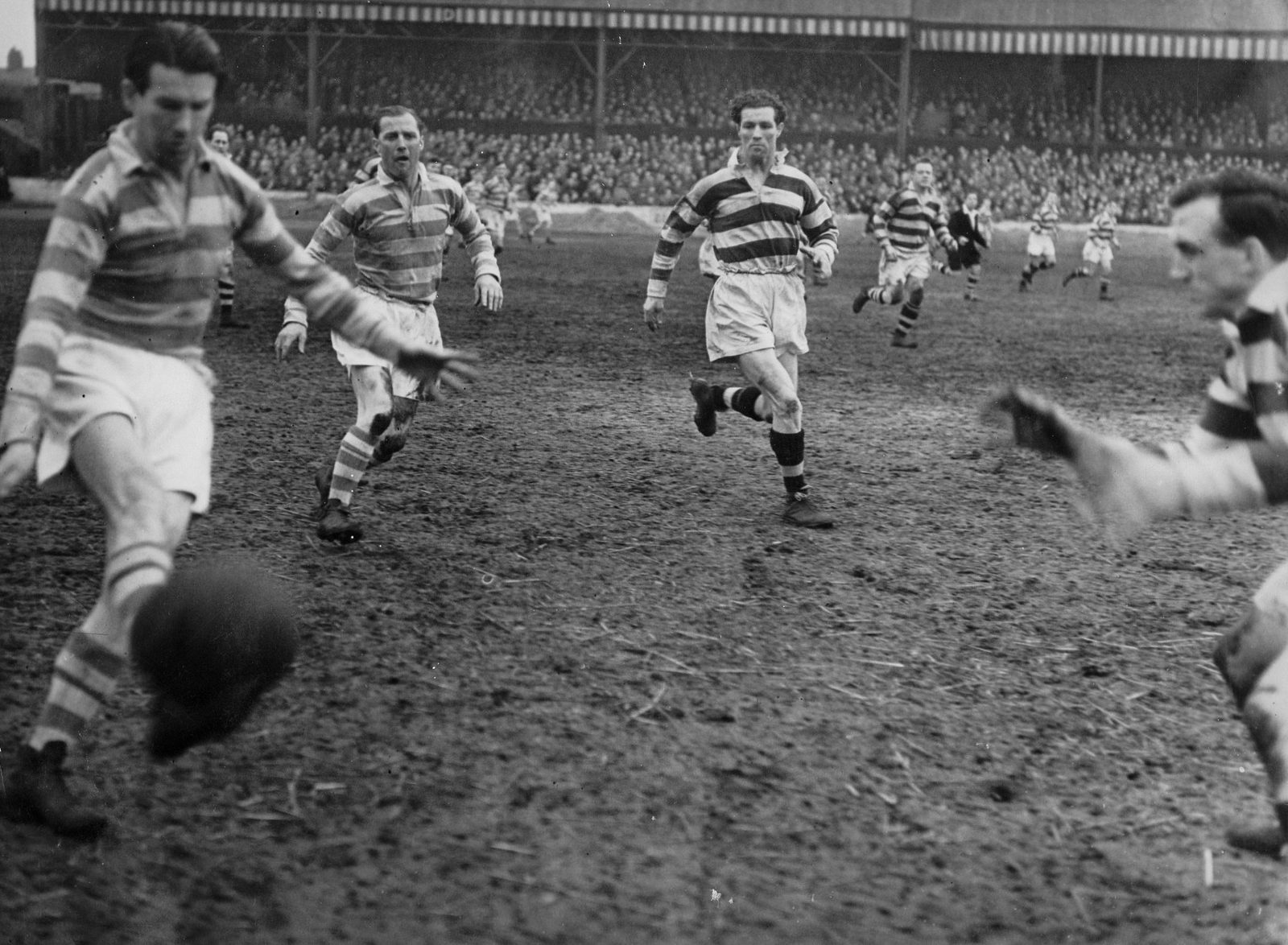 Joe Warham puts a kick over his opposite number v Widnes - March 18th 1950.