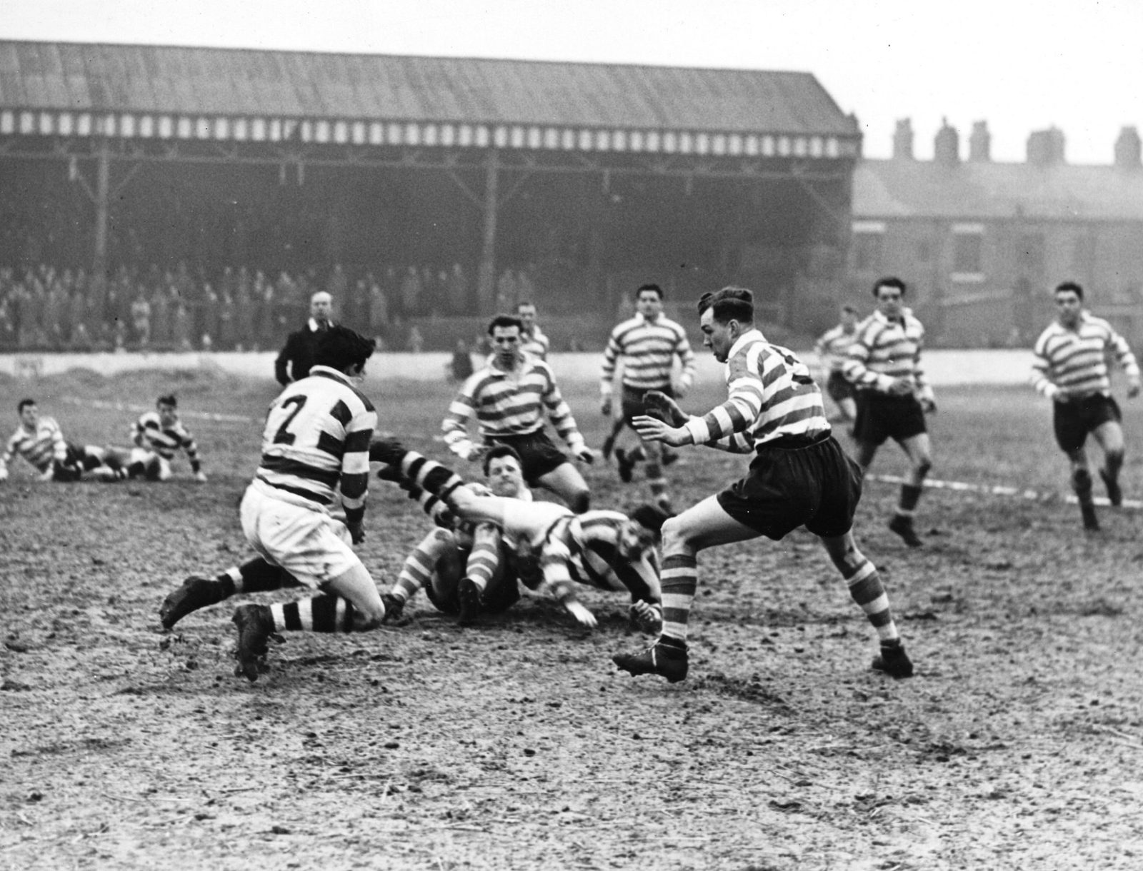 Kemel passes to Dawson in Ayres tackle - March 25th 1958.