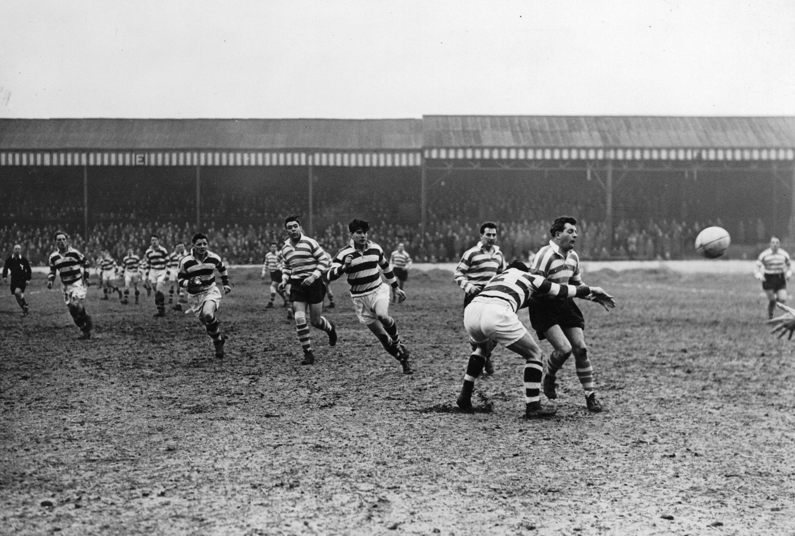 Dennis Ayres gets a pass away in Dawson's tackle v Widnes - March 25th 1958.