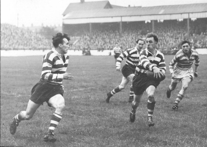 Frank Stirrup looks to give Terry O’Grady a reverse pass with Billy Mitchell in support - Aug 15th 1953.