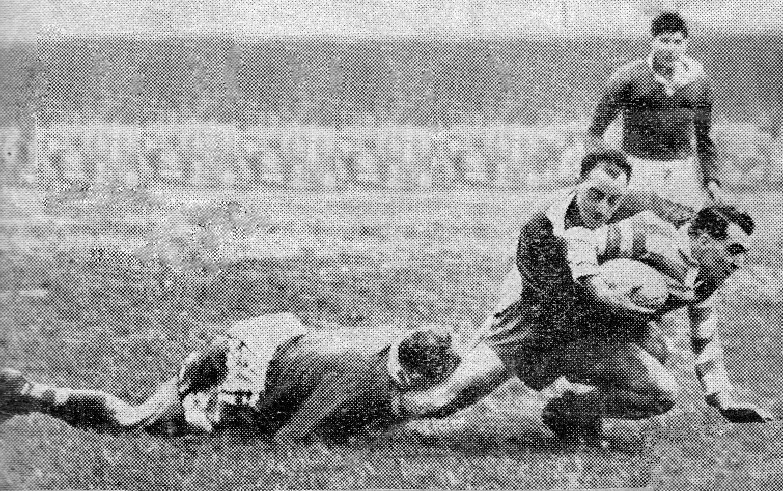 Dick Cracknell is tackled by Brian Nordgren and Jack Fleming - Nov 27th 1954.