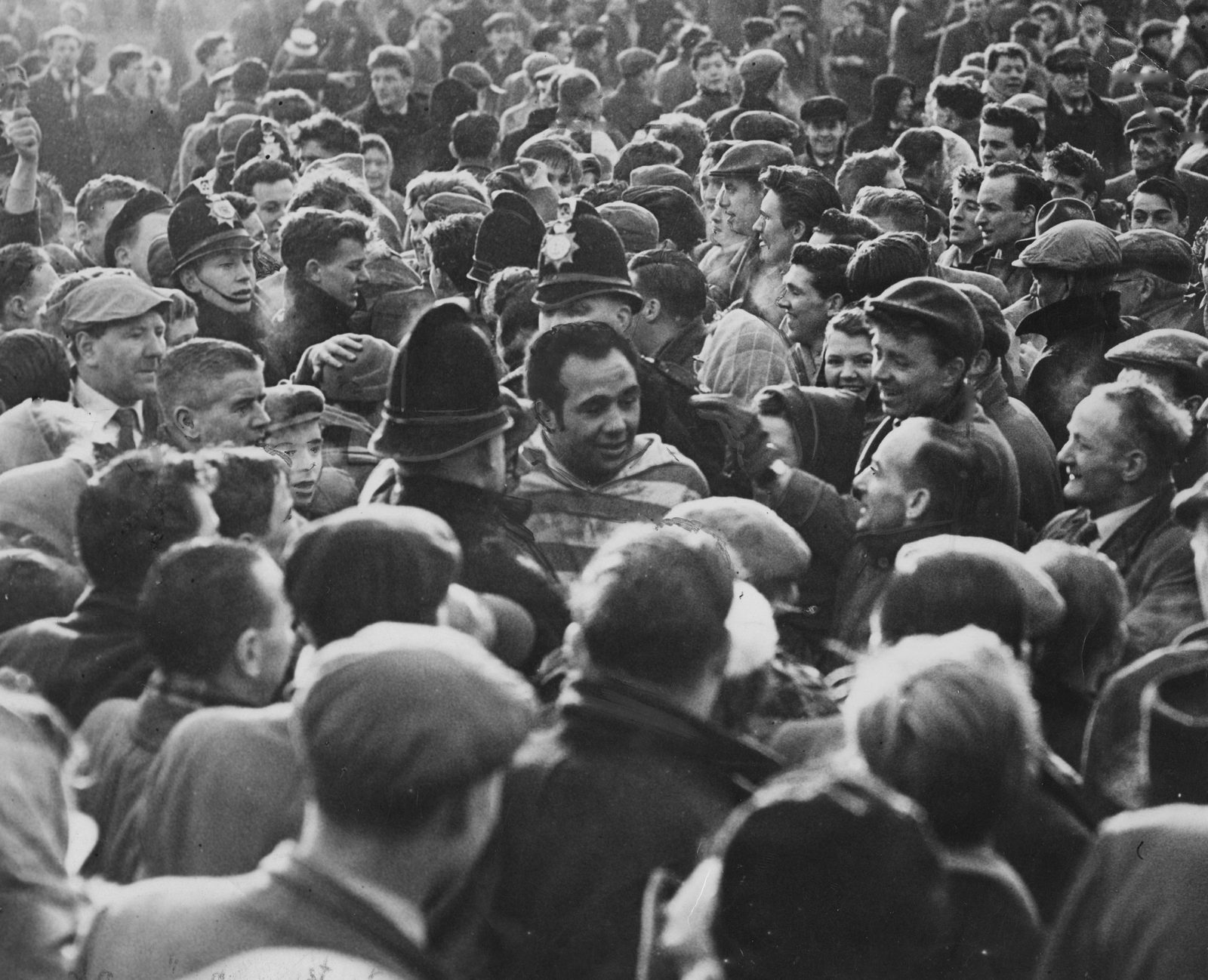 Wigan supporters mob Billy Boston at final whistle - March 8th 1958.