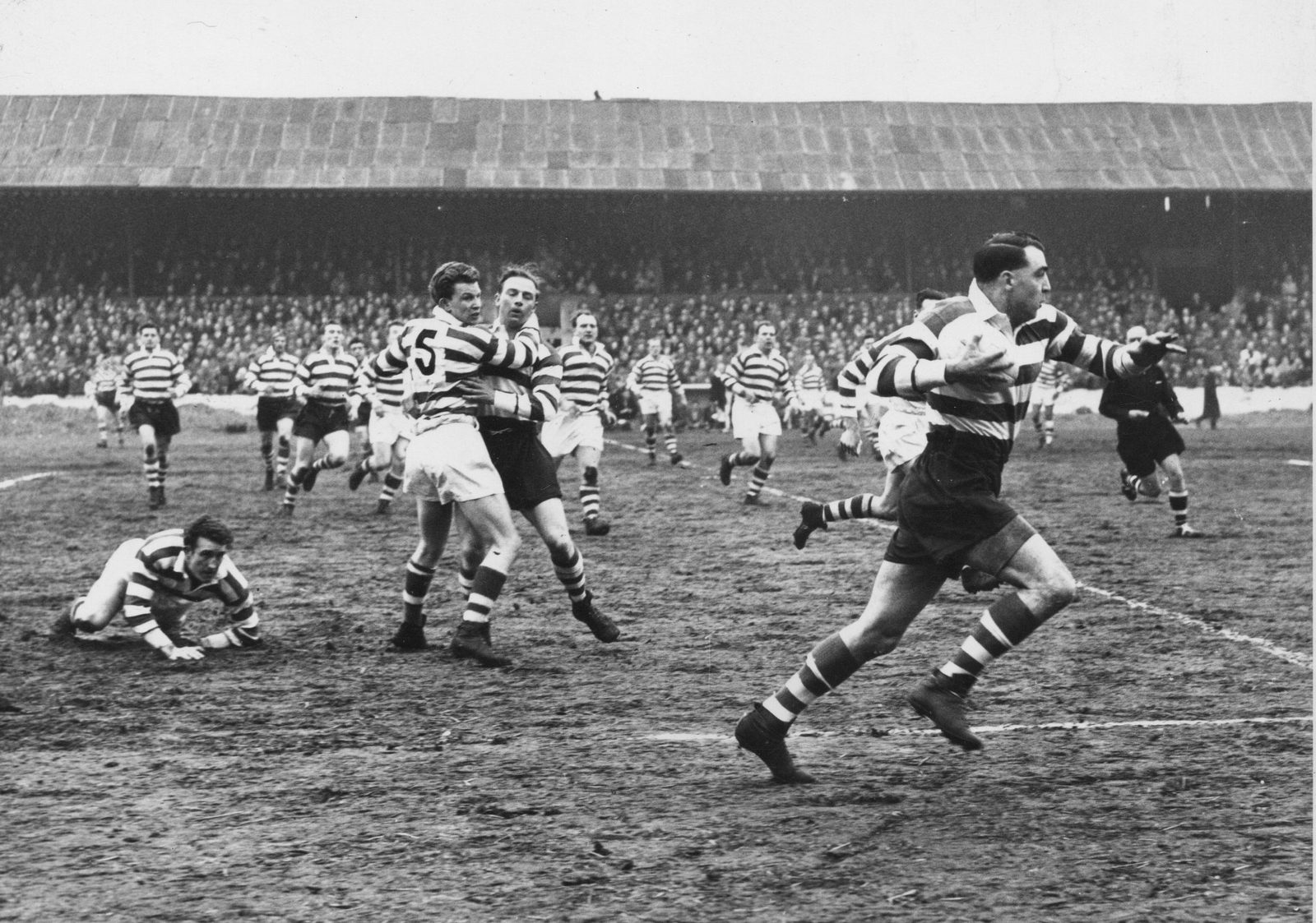 Dick Cracknell breaks clear as Mick Sullivan tackles Vince Nestor - April 5th 1958.