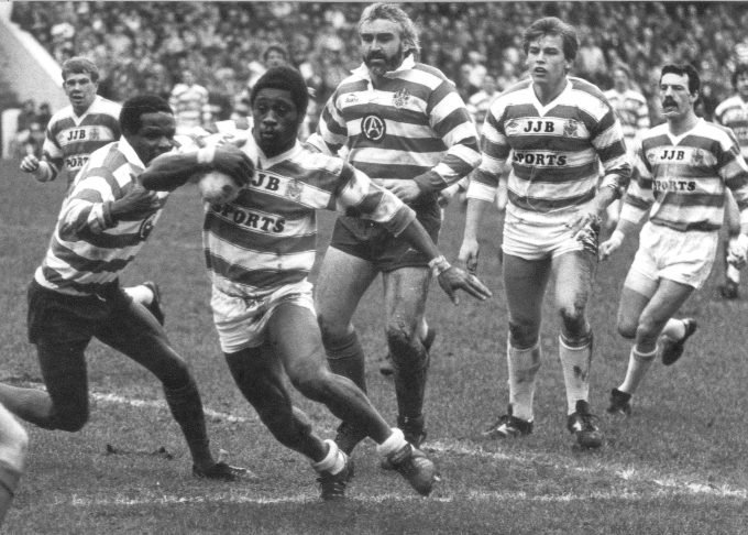 Henderson Gill tries to get away from Pat Mitchell and Alan McCurrie - April 8th 1985