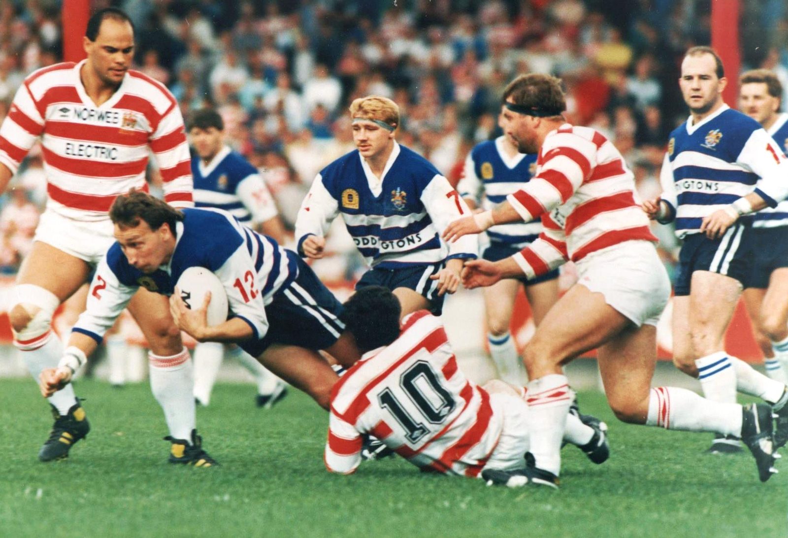 Colin Hawkyard falls to a tackle from Brian Case - Aug 28th 1988.