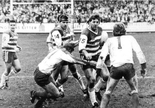 Steve Hampson waits for Paul Round as Dennis Betts makes the tackle - March 27th 1989.