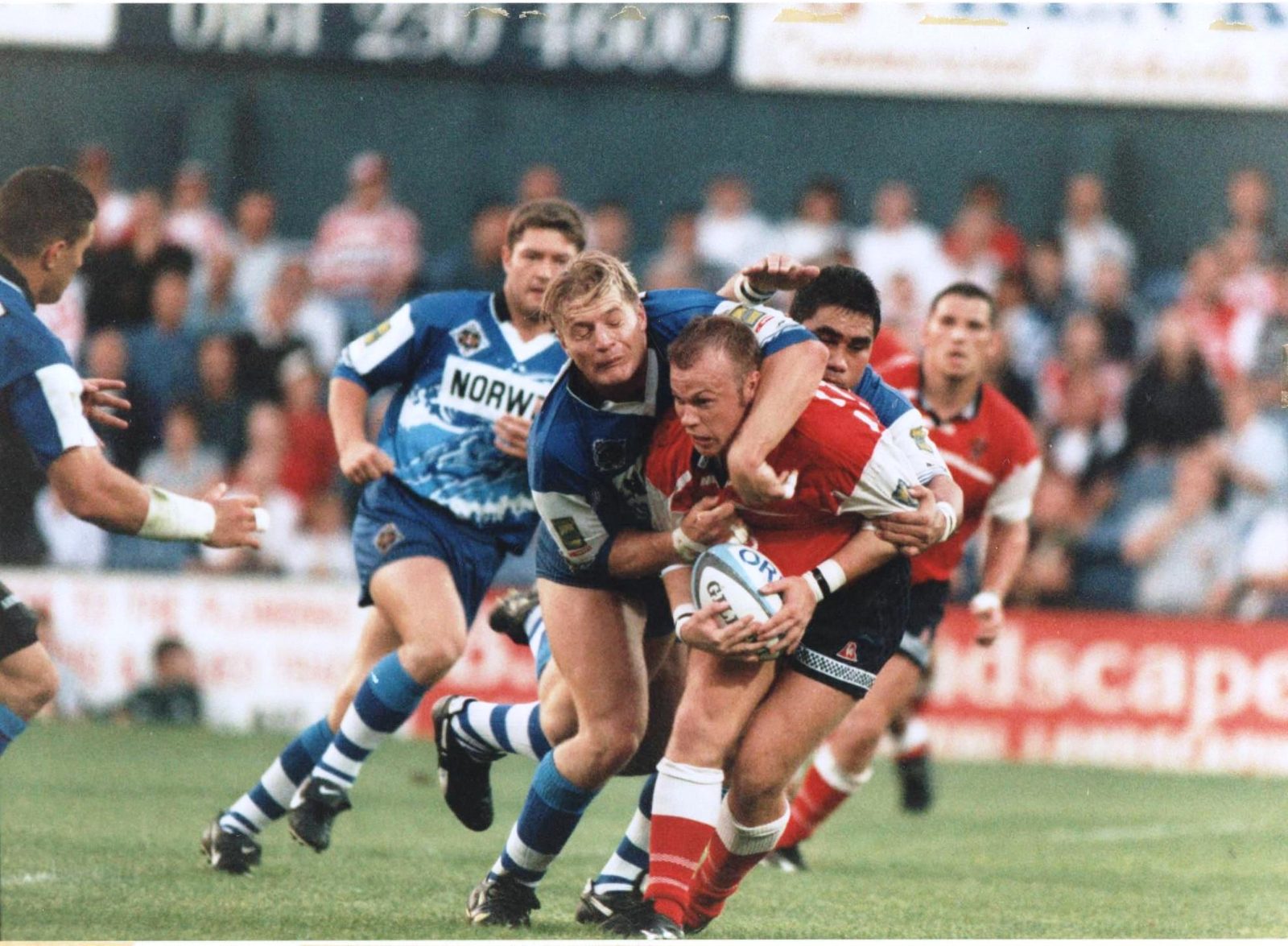 Chris McKinney is well held at Boundary Park by Simon Haughton and Harrison Hansen v Wigan - Aug 22nd 1997.