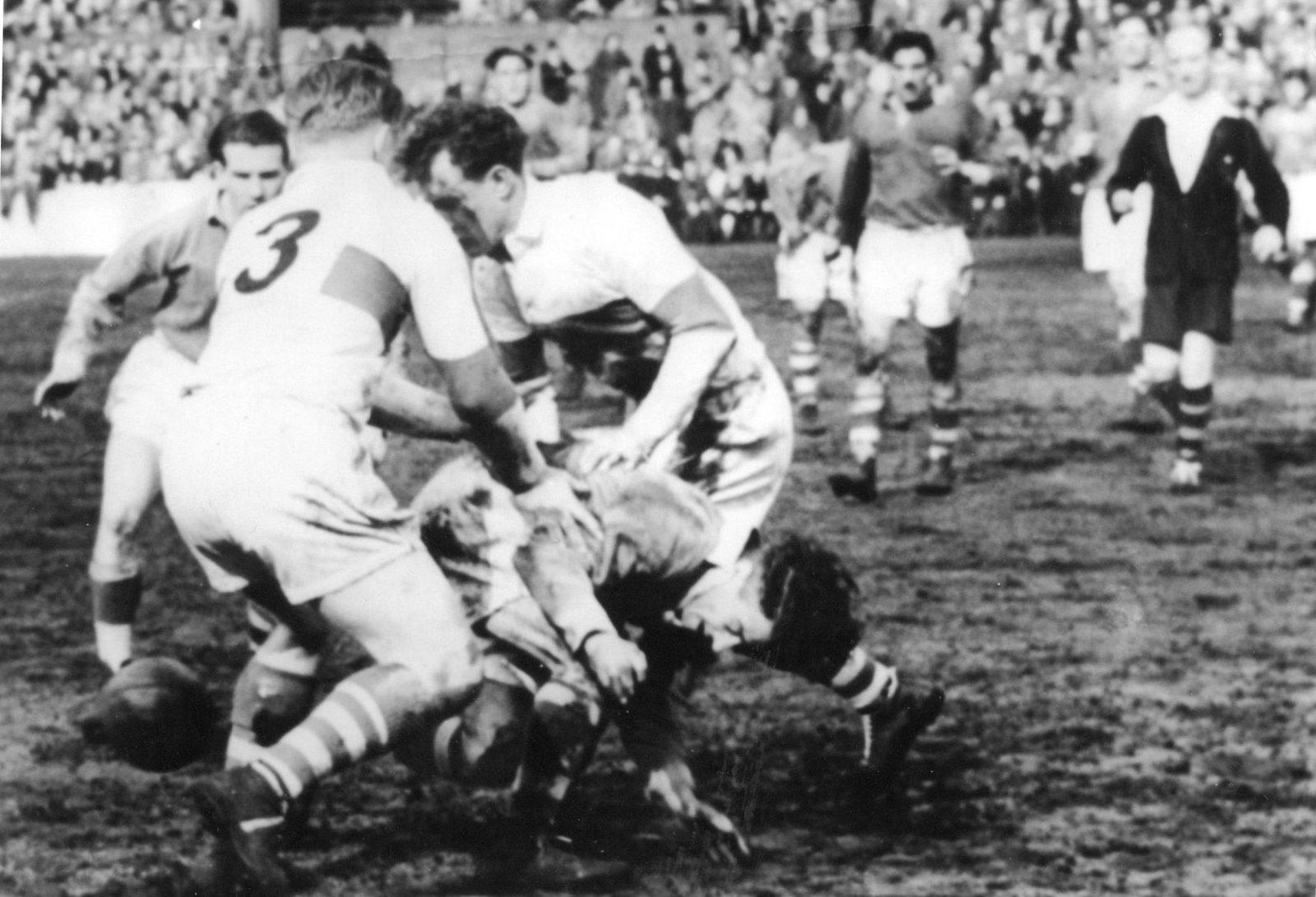 Joe Silva falls to a two man Workington tackle - April 15th 1950.