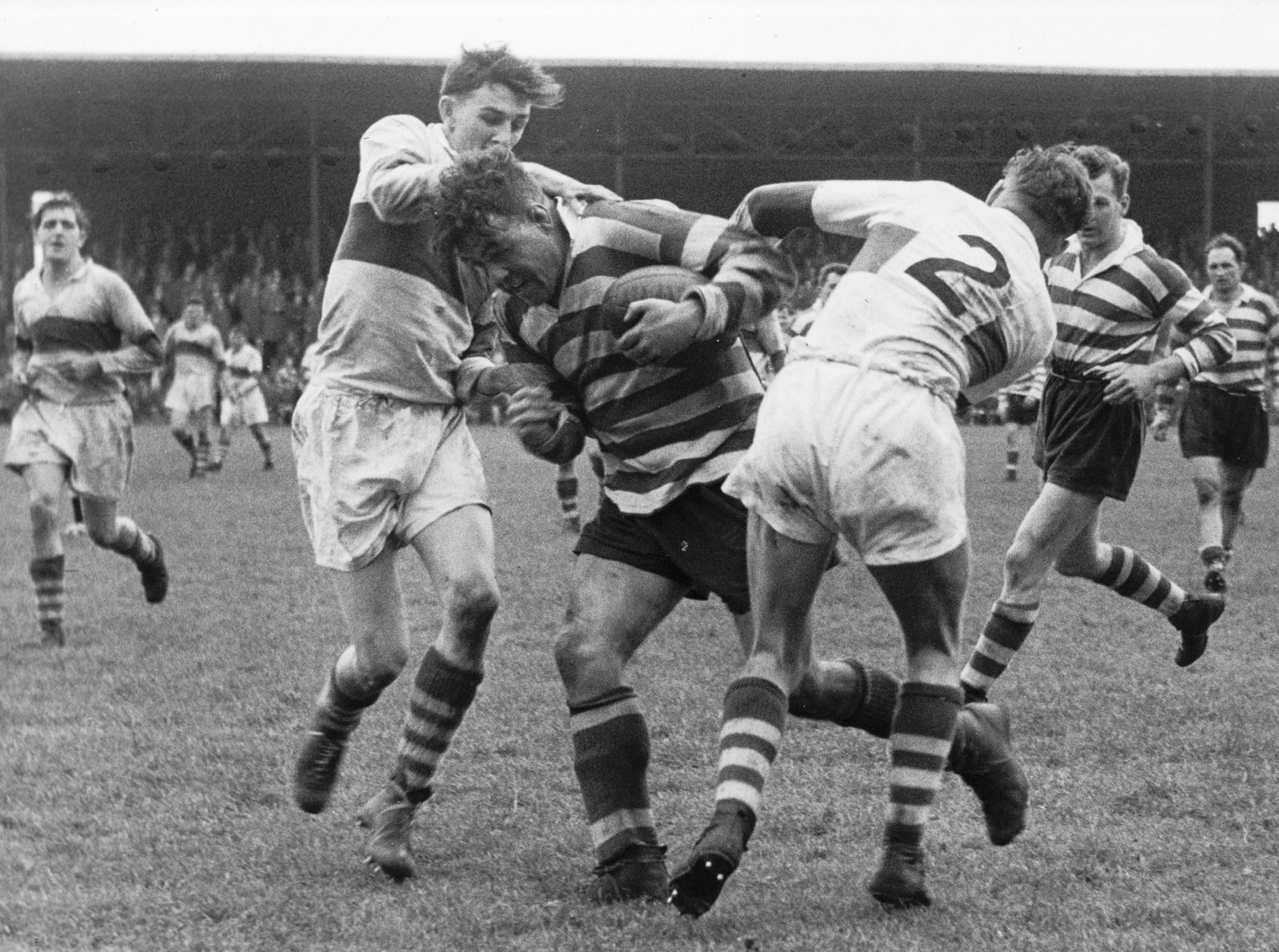 Ken Jackson avoids the attentions of Workington’s John O’Neill and Ike Southward to lay on a late try for Jack Keith - Sep 28th 1957.