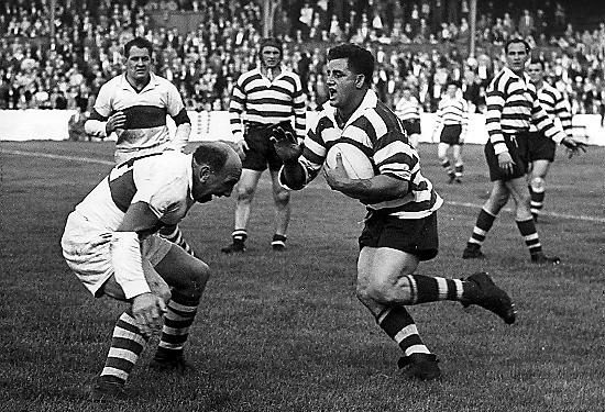 Derek Turner prepares to meet the tackle of Workington’s Billy Ivison - Sep 2nd 1958.