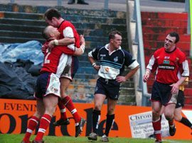 Gavin Dodd (left) is congratulated by Gareth Barber on completing his hat-trick of tries - April 5th 2003..