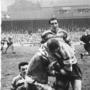 Wigan v Oldham. John Noon and John Rae wach a team-mate make a tackle - Jan 13th 1962.