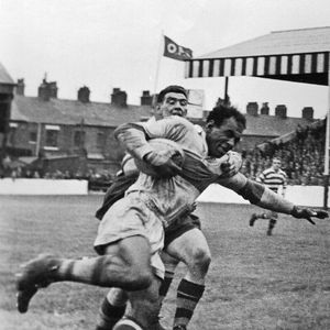 Cec Thompson is tackled by Len McIntyre - Oct 17th 1959.
