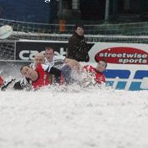Gareth Barber loses possession on a snow covered Boundary Park against Saddleworth Rangers - March 12th 2006.