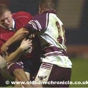 Adam Sharples is held in a two man tackle. -Nov 19th 2003.