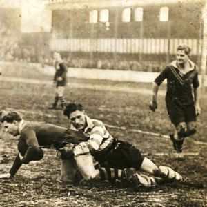 Jack `Duchy’ Holland on the left, Bob Lulham being tackled by John Donegan and Fred de Belin on the right. Dec 4th 1948.