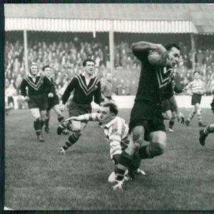 Alex Watson evades the tackle of Frank Stirrup. - Nov 7th 1956.