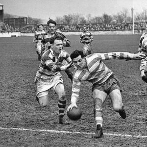 Alan Davies evades Arthur Gregory to touch down against Belle Vue backed up by Terry O'Grady - April 17th 1954.