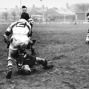 Emmitt tackles an Oldham player watched by Pitchford - Feb 22nd 1958.