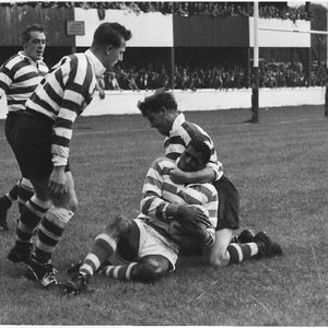 Des McKeown tackles Johnny Freeman with Vince Nestor and Bernard Ganley on hand - Aug 9th 1959.