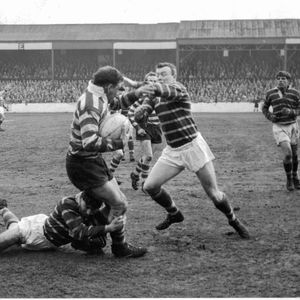 Len McIntyre is tackled by Booth and Breen of Huddersfield - April 23rd 1963.