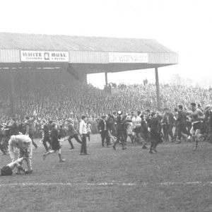 The Oldham fans invade the pitch after Len Mcintyre's equalising drop goal v HKR - April 11th 1964.