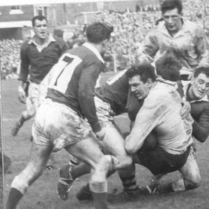 Charlie Bott is well tackled - April 11th 1964.