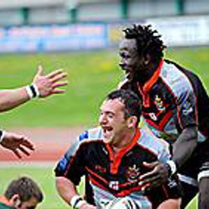 Tommy Goulden (centre) celebrates his try with Simeon Hoyle and Lucas Onyango v Hunslet - June 15th 2008.