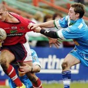 Keighley try all they can to hold back Oldham's Lee Wingfield - March 26th 2006.
