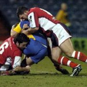 Barrie McDermott and Wayne Corcoran bring down a Leeds player - Jan 27th 2006.