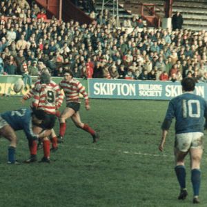 Alan McCurrie releases a pass in the tackle. Oldham v Leigh - Jan 8th 1984.