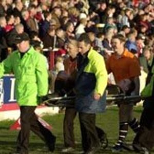 John Hough is carried off duringat Hilton Park Feb 15th 2004..