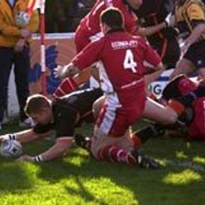 Oldham centre Iain Marsh crashes through to score the opening try of the game after only two minutes - Feb 15th 2004.