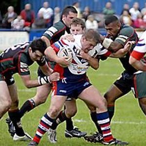 Adam Robinson tries to push away Puna Rasaubale after receiving possession v London Skolars - June 7th 2008.