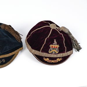The caps of Ned Blomley. The original green cap was relaced by the plumb colour in the early 1890s.