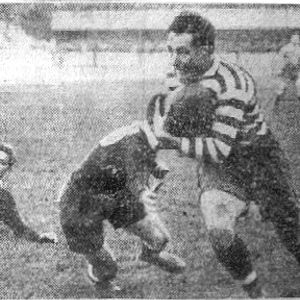 Joe Corsi evades a New Zealand opponent after taking a pass from the grounded George Hesketh - Oct 23rd 1926.