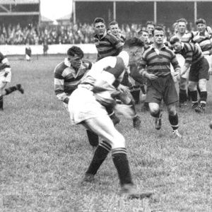 Alex Givvons kicks through in the 1935 Infirmary Cup match at the Athletic Grounds - Aug 24th 1935.
