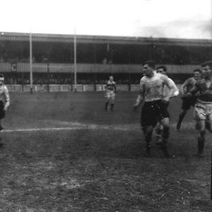 Ken Lowe attempts to evade a Rochdale tackle - April 18th 1938.